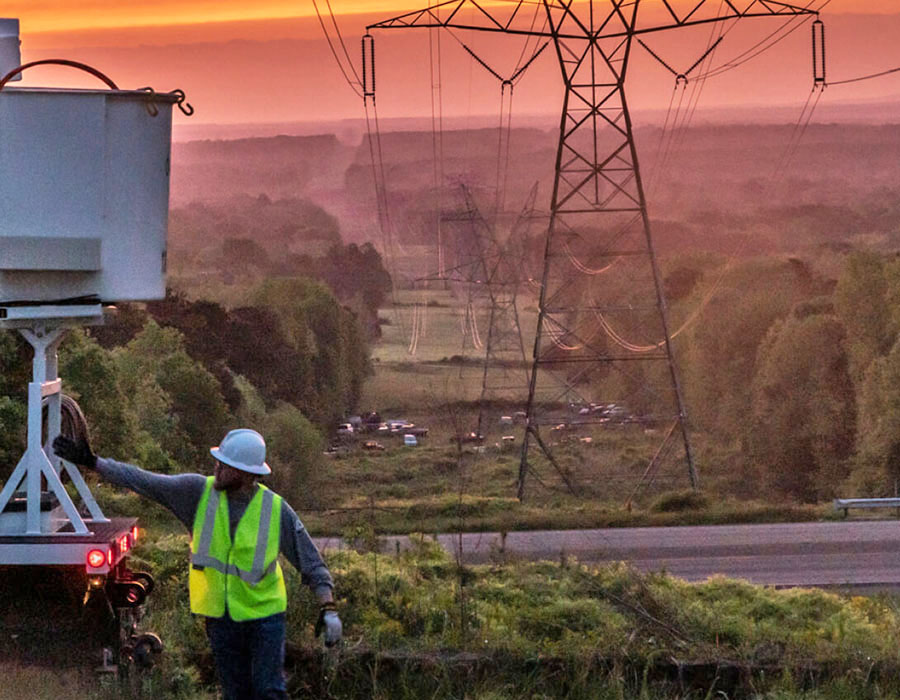 A Sempra Texas employee working on power lines
