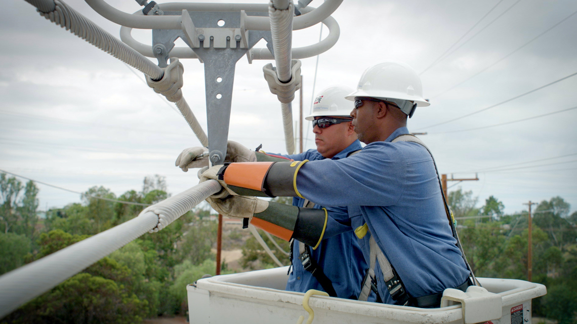 SDG&E team members replace wooden poles with fire-resistant steel ones