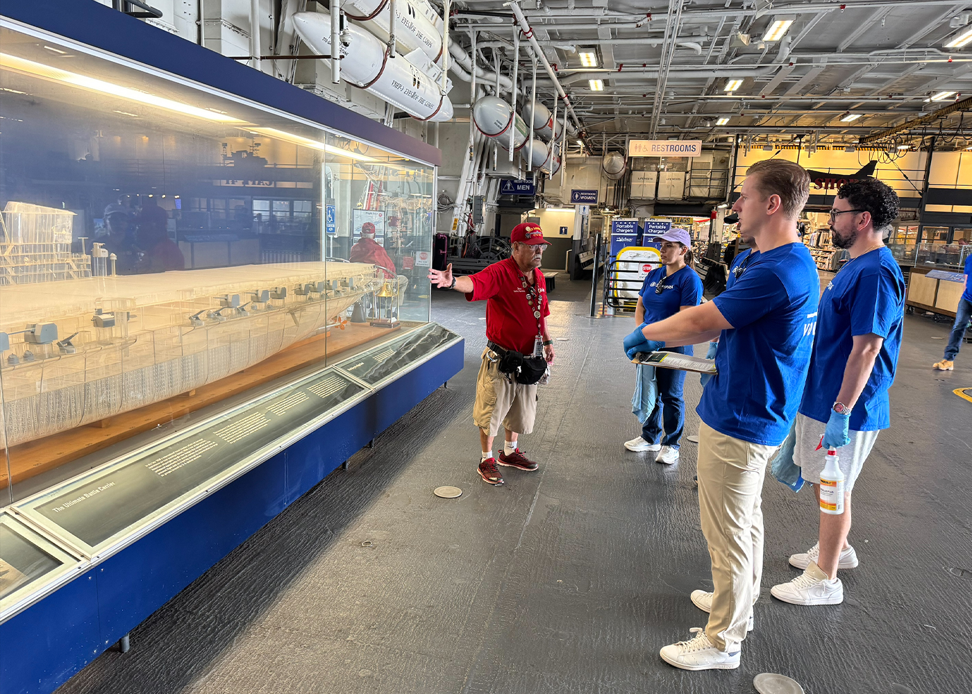 Sempra volunteers learning about the USS Midway